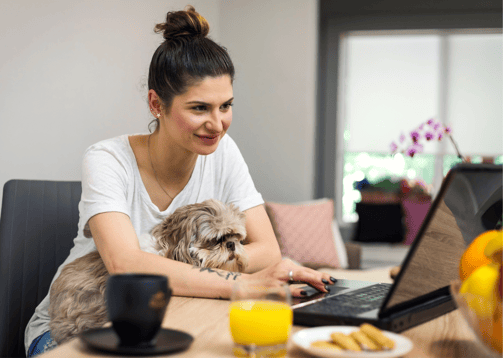 woman working from home with her dog